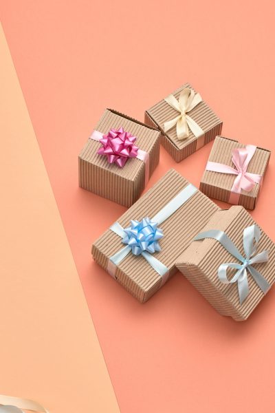 Valentines Day. Gift boxes, ribbon, holiday art Valentines Day. Gift boxes, ribbon pastel set. Minimal. Creative art fashion greeting card. Flat lay. Presents on design coral beige color. Holiday gift shopping sale fashionable concept, banner