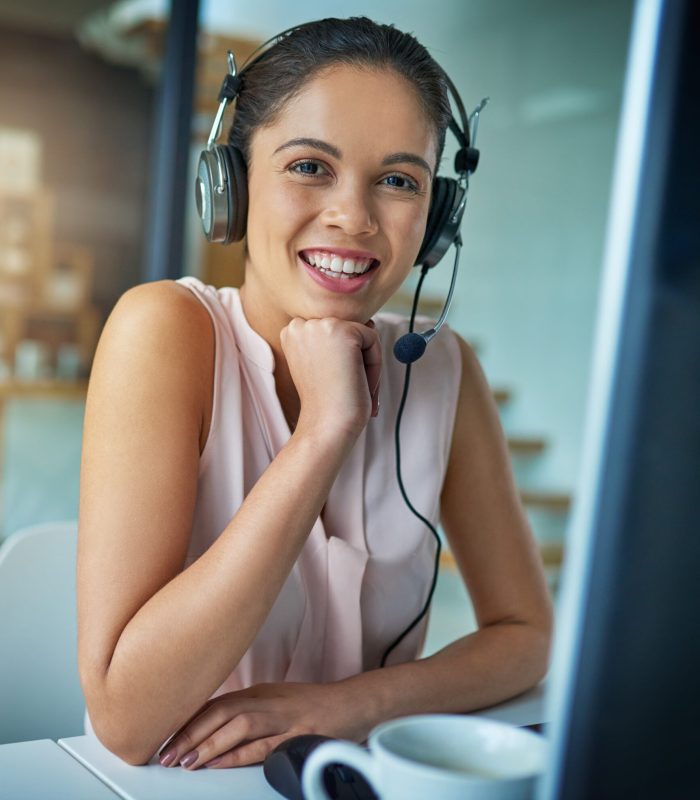 here-to-help-you-with-your-queries-shot-of-a-youn-2022-09-30-22-45-00-utc Here to help you with your queries. Shot of a young woman working in a call center